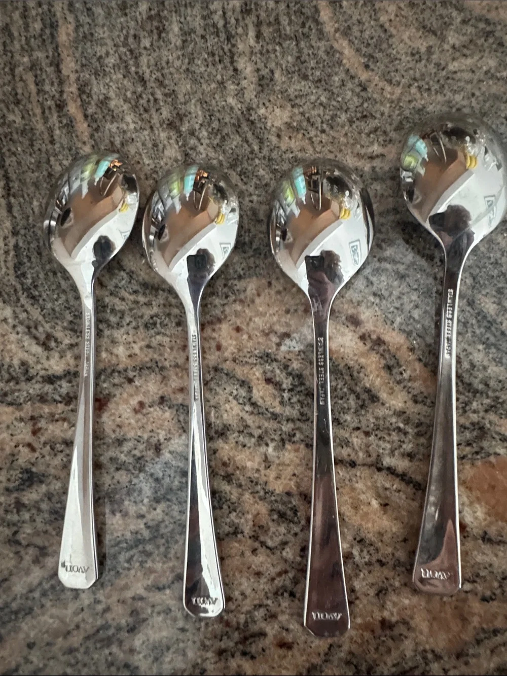 Vintage Avon stainless steel fruit spoons. Set of 4